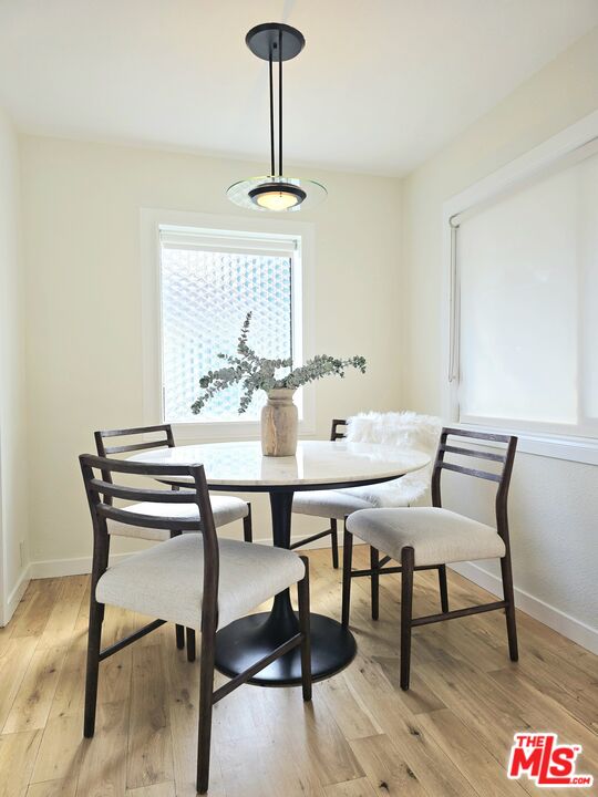 2520 Midvale Avenue Los Angeles, CA 90064 - Photo 8 of 25 a view of a dining room with furniture window and wooden floor