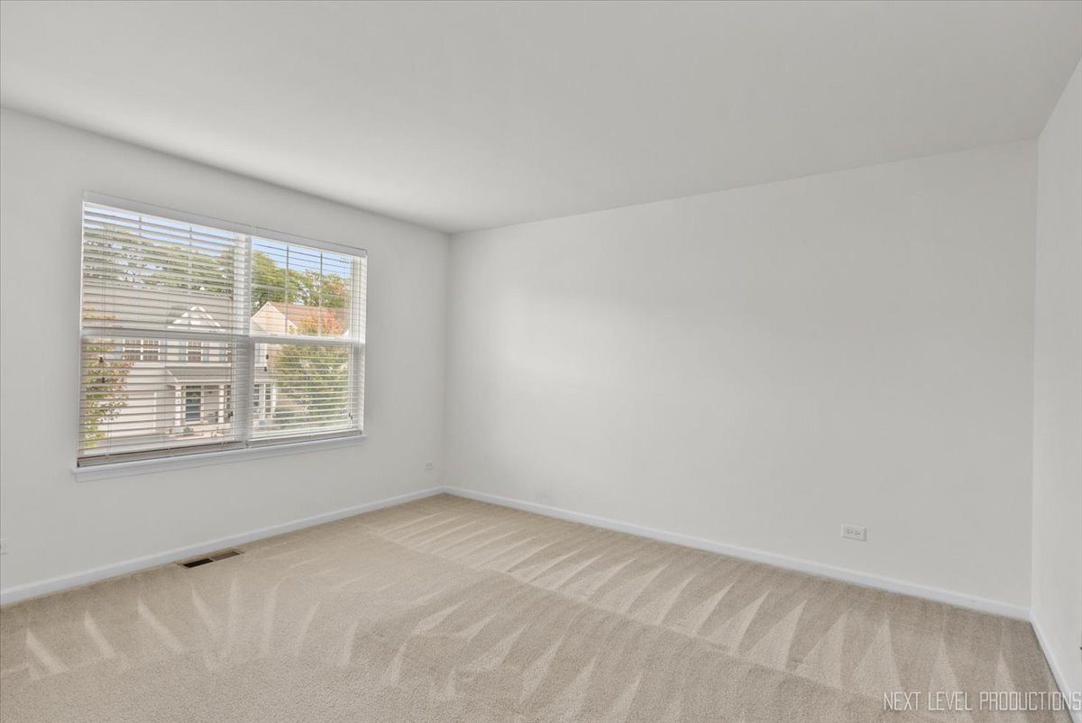 5734 Oak Ridge Way Lisle, IL 60532 - Photo 12 of 28 an empty room with a window