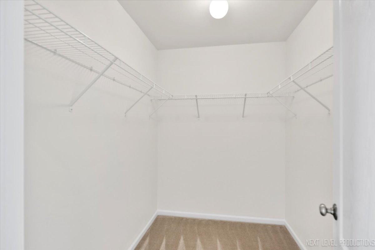 5734 Oak Ridge Way Lisle, IL 60532 - Photo 20 of 28 a view of a room with racks on the wall