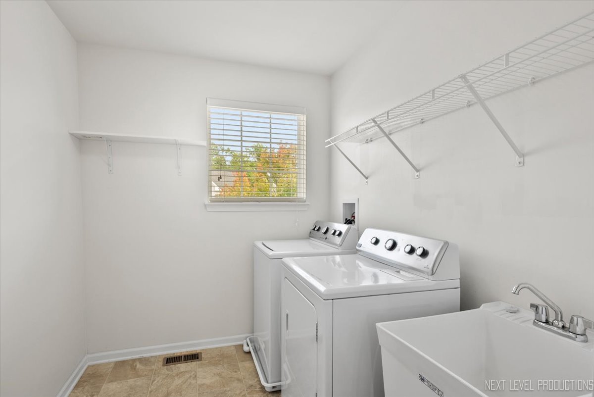 5734 Oak Ridge Way Lisle, IL 60532 - Photo 23 of 28 a bathroom with a sink and a toilet