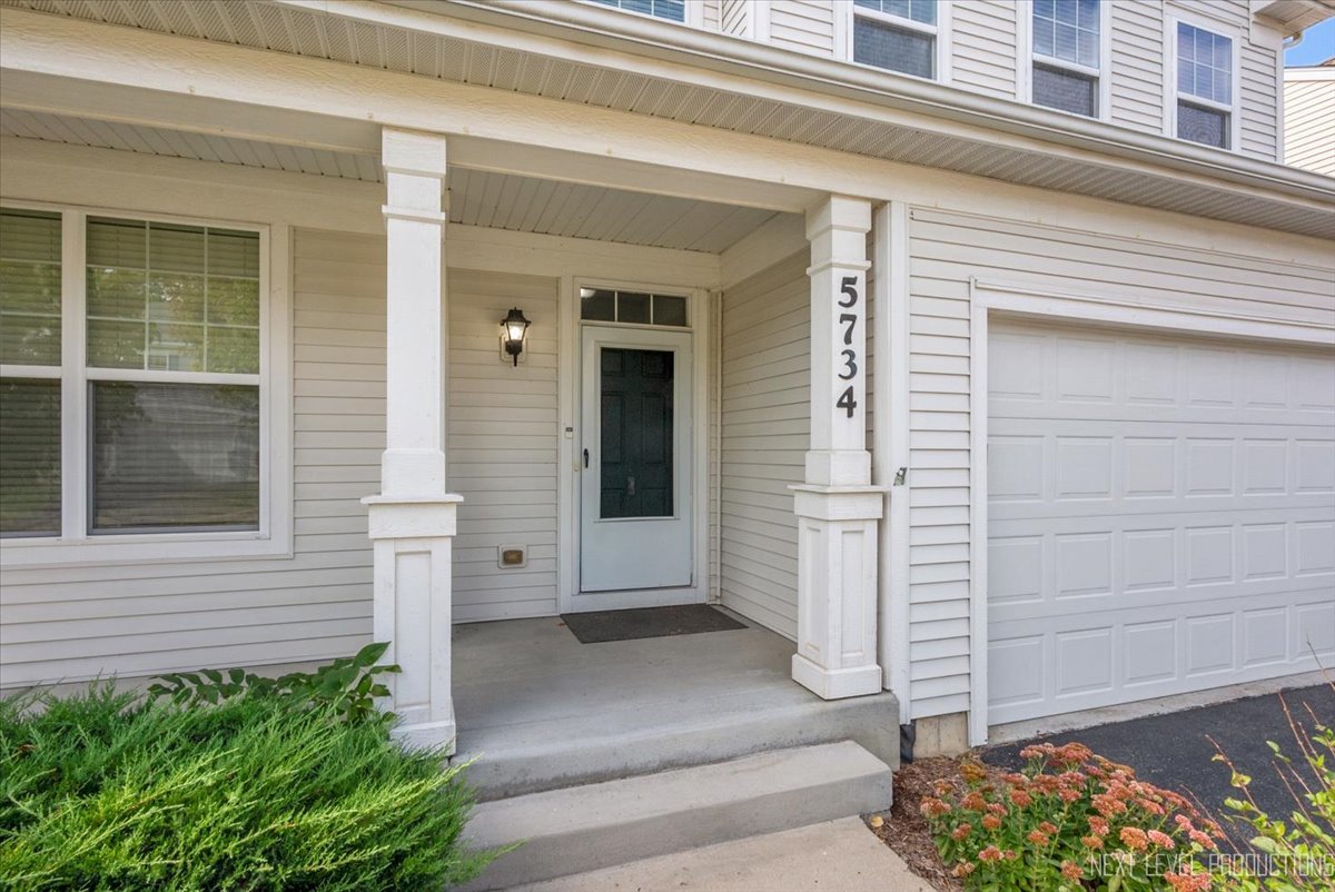 5734 Oak Ridge Way Lisle, IL 60532 - Photo 4 of 28 an entrance view of a house