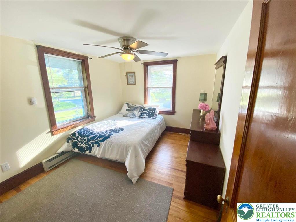 244 Learn Road Tannersville, PA 18372 - Photo 12 of 69 a bedroom with a bed and a mirror