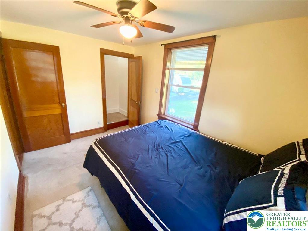 244 Learn Road Tannersville, PA 18372 - Photo 18 of 69 a view of a room with wooden floor and a ceiling fan