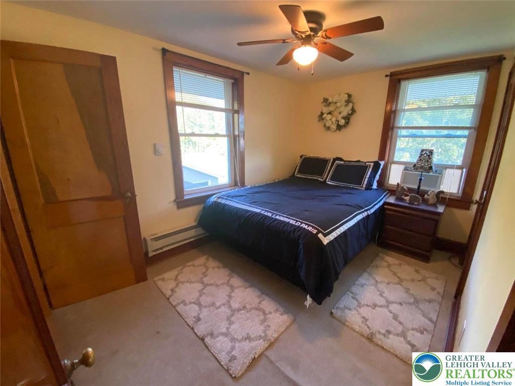 244 Learn Road Tannersville, PA 18372 - Photo 20 of 69 a bedroom with a bed and a window