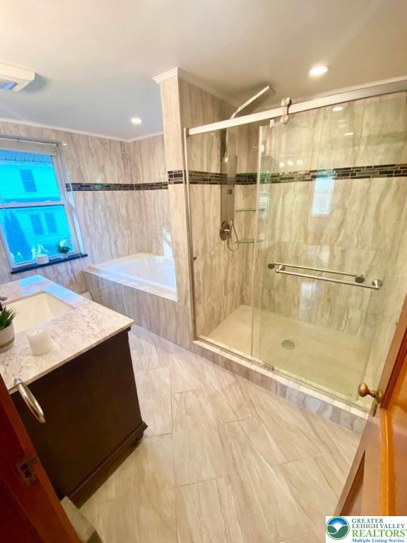 244 Learn Road Tannersville, PA 18372 - Photo 24 of 69 a bathroom with a bathtub and a shower