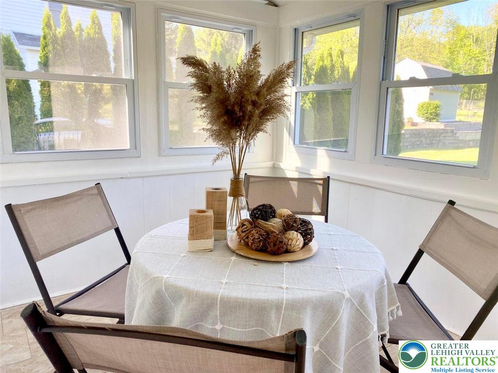 244 Learn Road Tannersville, PA 18372 - Photo 34 of 69 a living room with furniture and a large window