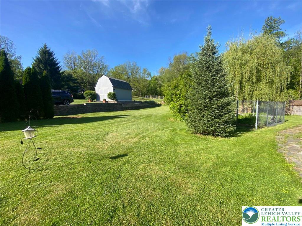 244 Learn Road Tannersville, PA 18372 - Photo 43 of 69 a view of a garden and basketball court