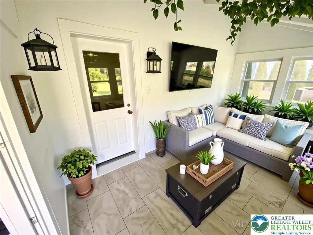 244 Learn Road Tannersville, PA 18372 - Photo 58 of 69 a living room with furniture and a potted plant