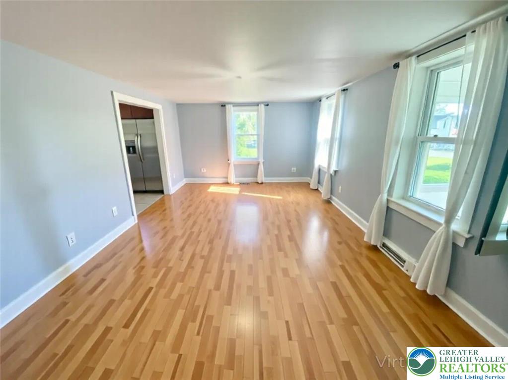 244 Learn Road Tannersville, PA 18372 - Photo 65 of 69 a view of an empty room with wooden floor and a window