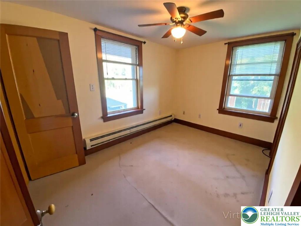 244 Learn Road Tannersville, PA 18372 - Photo 66 of 69 an empty room with windows and fan