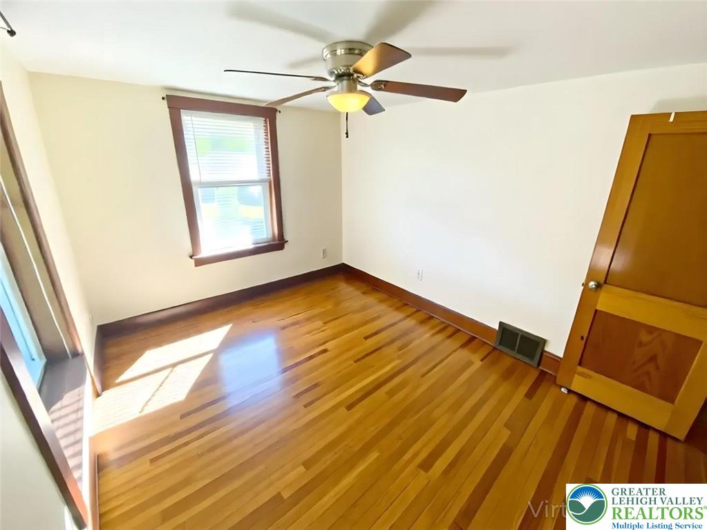 244 Learn Road Tannersville, PA 18372 - Photo 68 of 69 a view of an empty room with a window and wooden floor