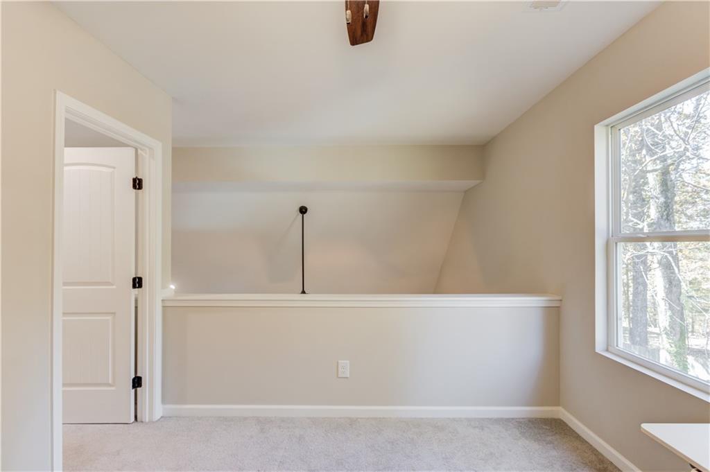 6137 Timberidge Drive Gainesville, GA 30506 - Photo 25 of 50 a view of an empty room with windows