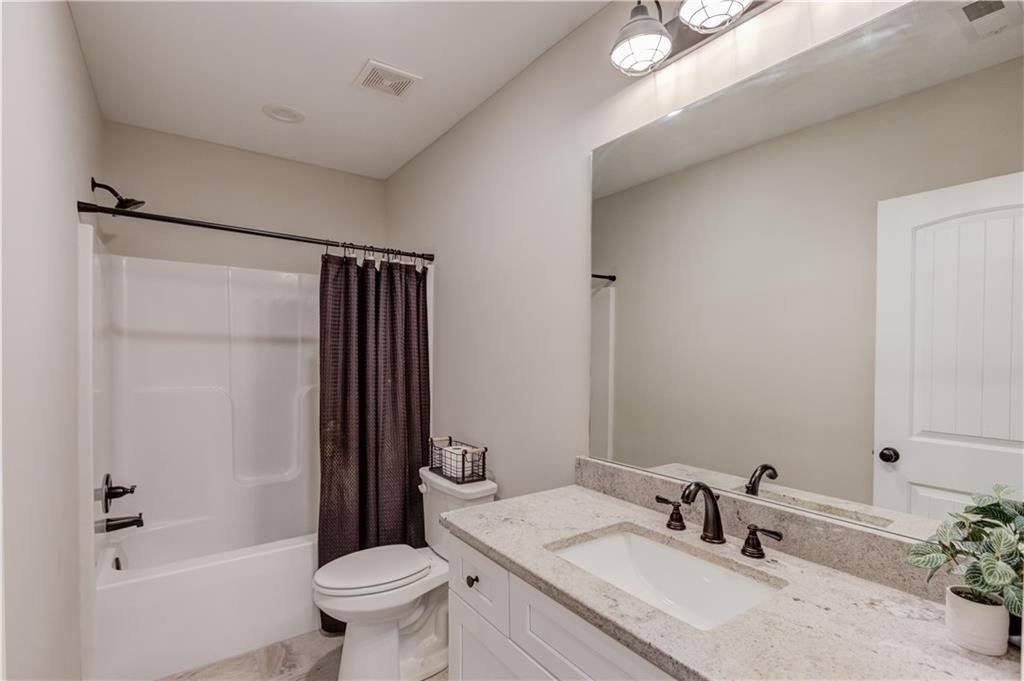 6137 Timberidge Drive Gainesville, GA 30506 - Photo 30 of 50 a bathroom with a sink toilet and shower