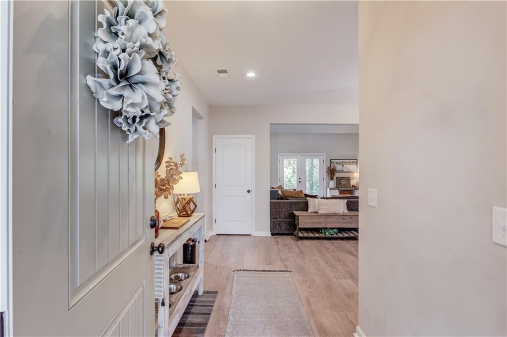 6137 Timberidge Drive Gainesville, GA 30506 - Photo 3 of 50 a living room with furniture and a chandelier