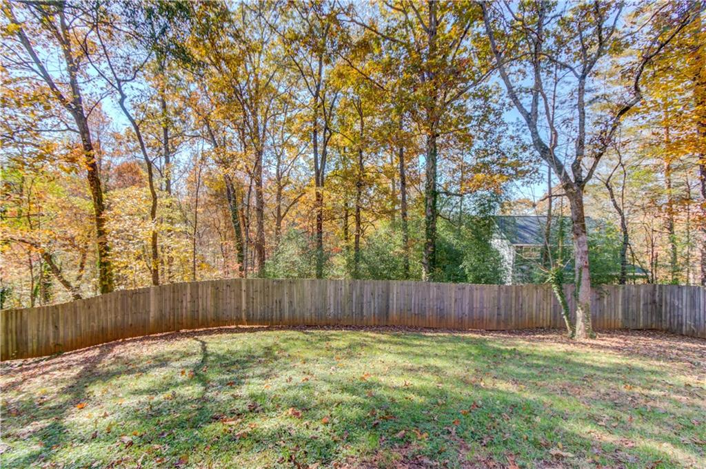 6137 Timberidge Drive Gainesville, GA 30506 - Photo 33 of 50 a backyard with tall trees