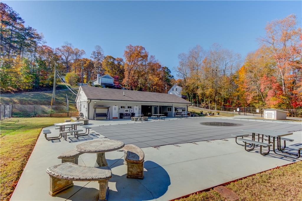 6137 Timberidge Drive Gainesville, GA 30506 - Photo 40 of 50 a view of a house with backyard and sitting area