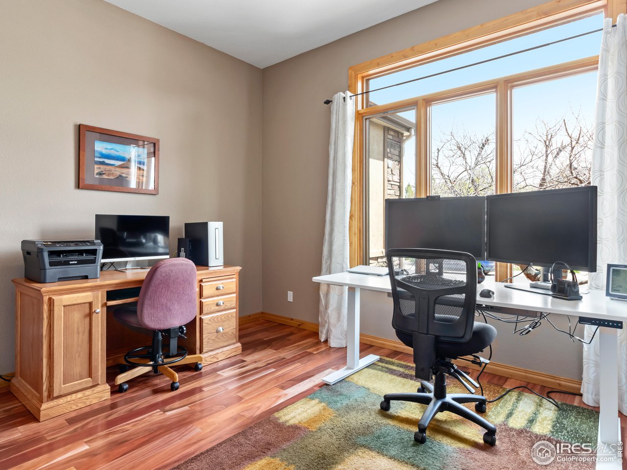 8193 Admiral Drive Windsor, CO 80528 - Photo 16 of 39 a view of a workspace with furniture and a window