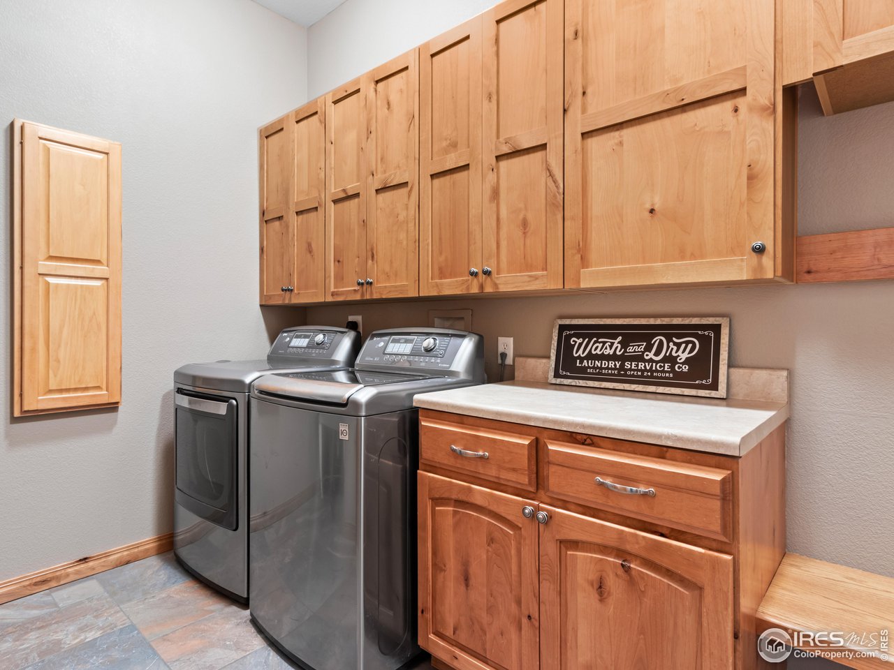 8193 Admiral Drive Windsor, CO 80528 - Photo 25 of 39 a view of a storage and utility room with washer and dryer