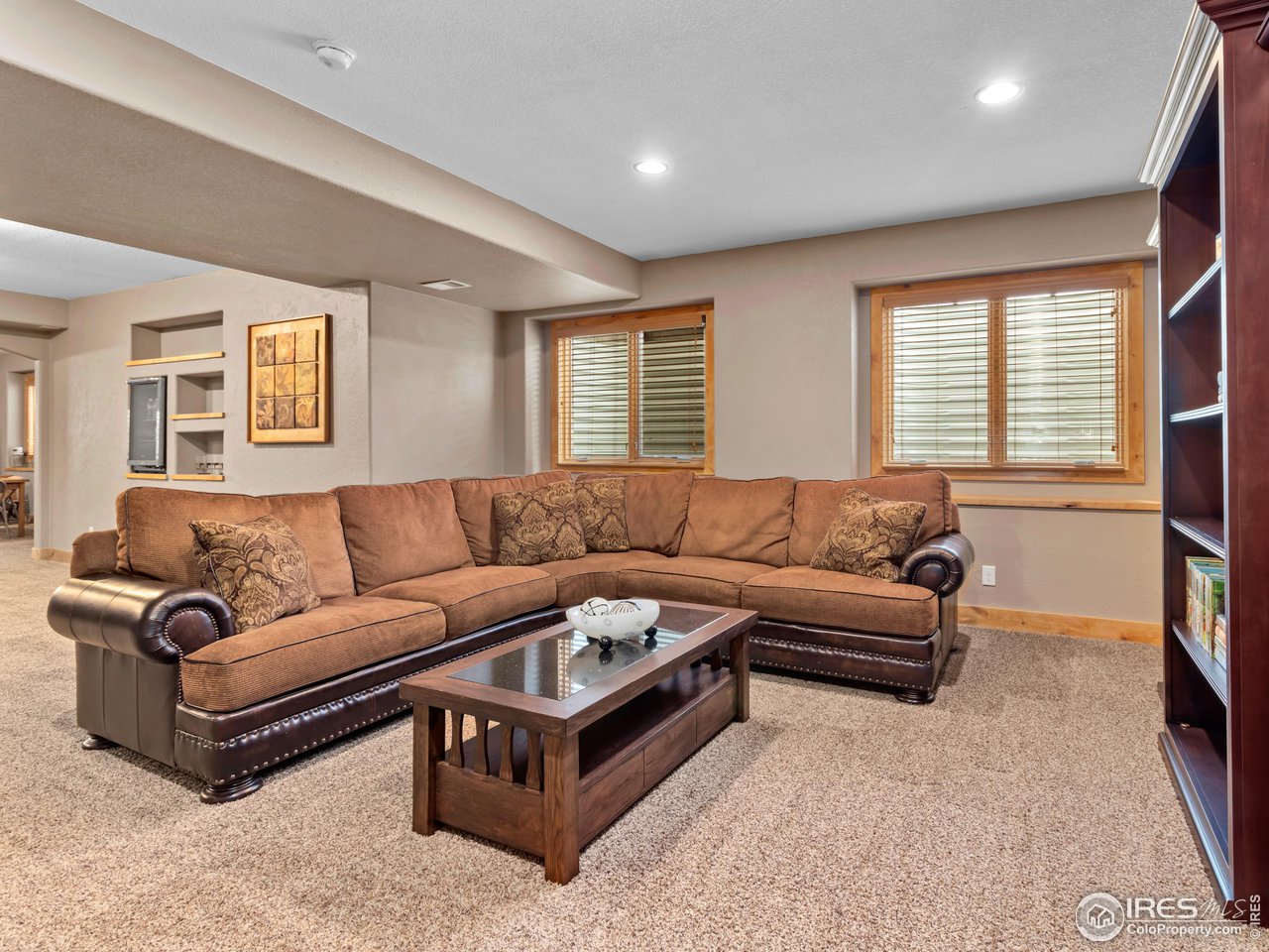 8193 Admiral Drive Windsor, CO 80528 - Photo 26 of 39 a living room with a couch wooden floor and a window
