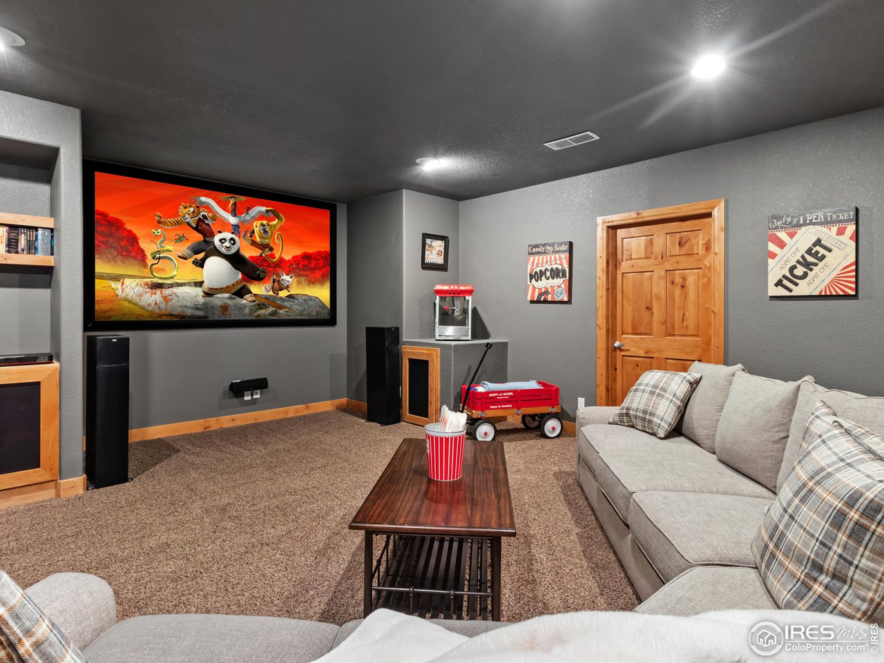 8193 Admiral Drive Windsor, CO 80528 - Photo 32 of 39 a living room with furniture and a flat screen tv