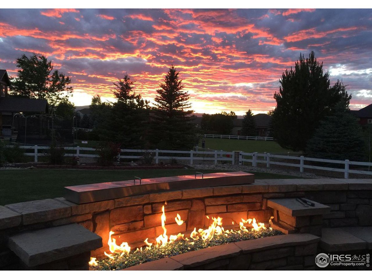 8193 Admiral Drive Windsor, CO 80528 - Photo 6 of 39 a view of a back yard from a lake