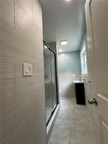 a view of a refrigerator in a bathroom