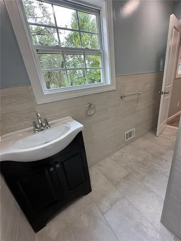 a sink sitting next to a window