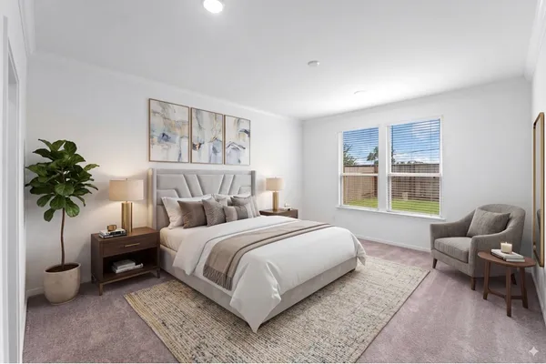 a bedroom with a bed and chair