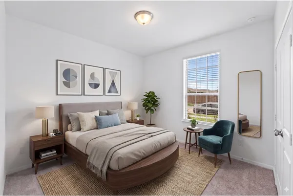 a bedroom with a bed and glass window