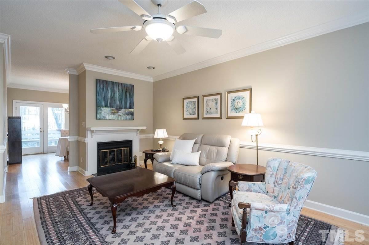 7921 Footman Way Raleigh, NC 27615 - Photo 2 of 28 a living room with furniture and a fireplace