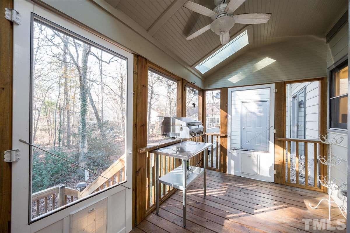7921 Footman Way Raleigh, NC 27615 - Photo 23 of 28 a view of a dining room with furniture large windows and wooden floor