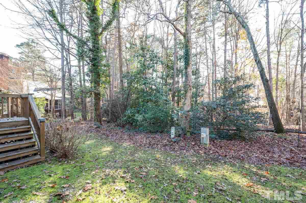 7921 Footman Way Raleigh, NC 27615 - Photo 26 of 28 a view of a backyard with trees