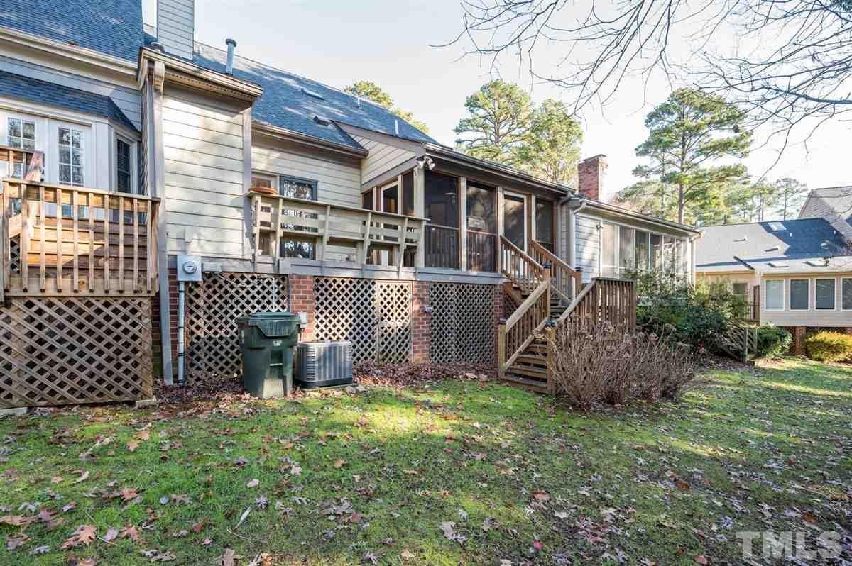 7921 Footman Way Raleigh, NC 27615 - Photo 27 of 28 a front view of a house with a garden