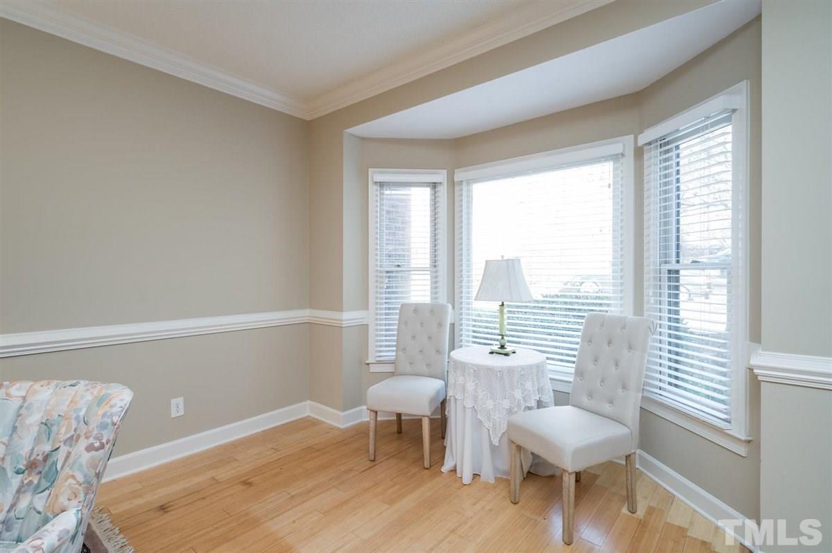 7921 Footman Way Raleigh, NC 27615 - Photo 5 of 28 a living room with furniture and a large window