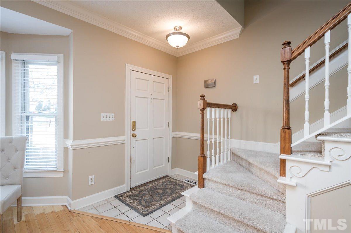 7921 Footman Way Raleigh, NC 27615 - Photo 6 of 28 a view of a hallway with windows