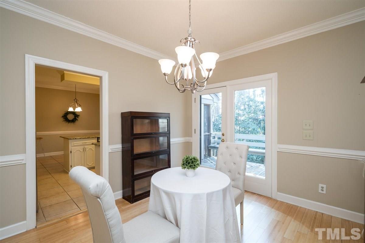 7921 Footman Way Raleigh, NC 27615 - Photo 9 of 28 a dining room with furniture and window