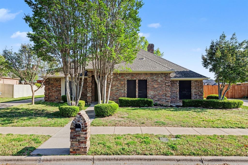 505 Springhill Drive Hurst, TX 76054 - Photo 1 of 25 a front view of a house with a yard