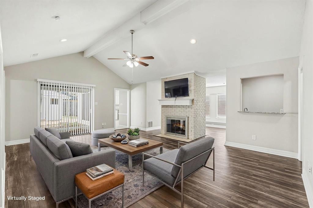 505 Springhill Drive Hurst, TX 76054 - Photo 3 of 25 a living room with furniture and a fireplace