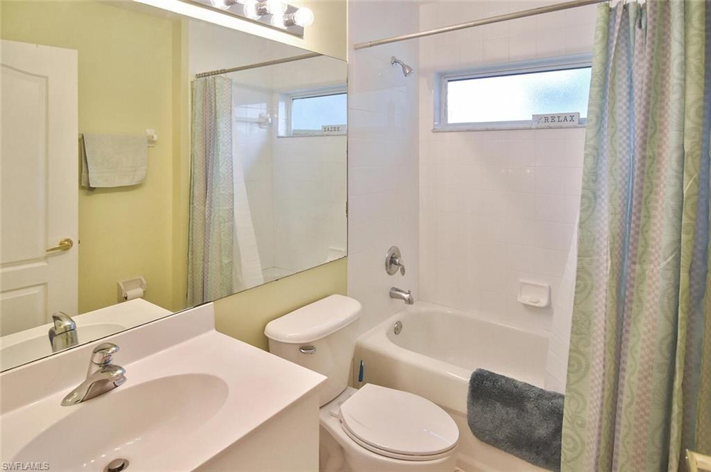 3870 Sawgrass Way, Unit 2521 Naples, FL 34112 - Photo 12 of 46 a bathroom with a sink a toilet and shower