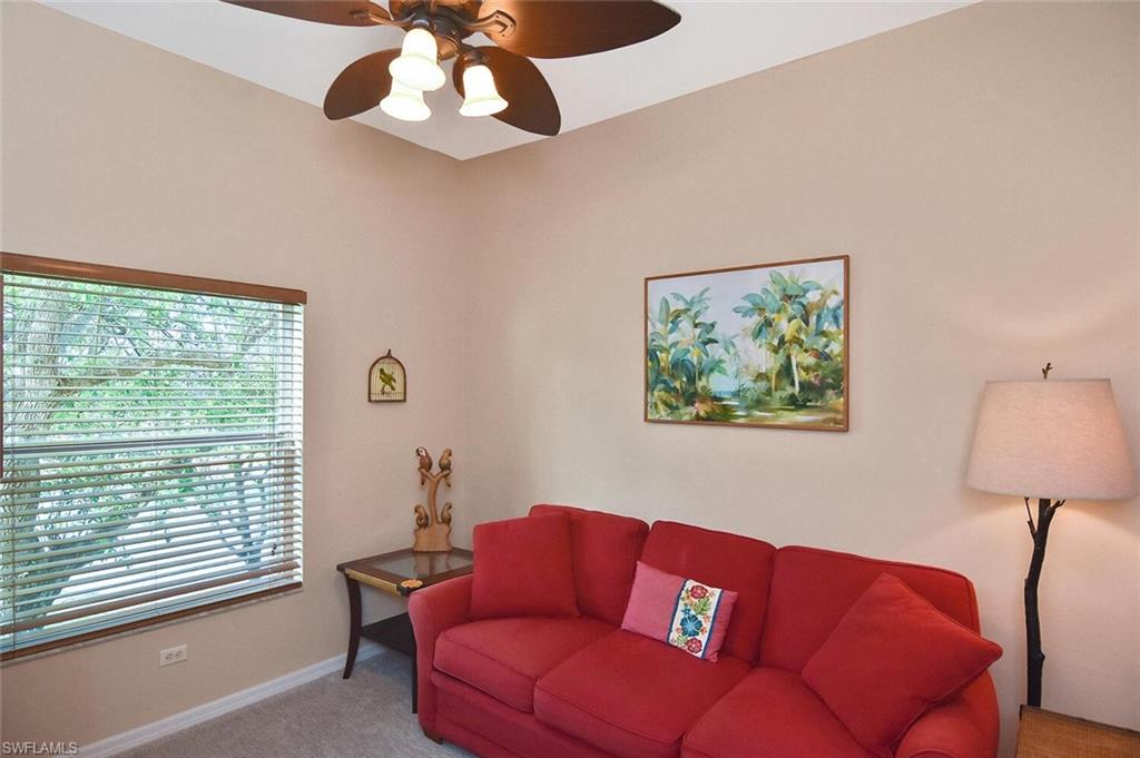 3870 Sawgrass Way, Unit 2521 Naples, FL 34112 - Photo 17 of 46 a living room with furniture and a window