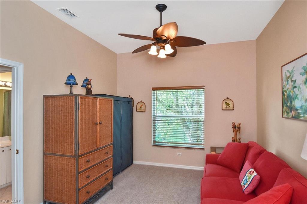 3870 Sawgrass Way, Unit 2521 Naples, FL 34112 - Photo 18 of 46 a living room with furniture and a window