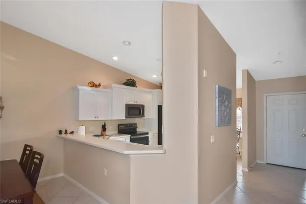 a kitchen with cabinets a sink and appliances