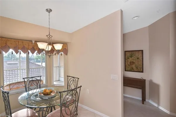 a view of a dining room with furniture window and outside view