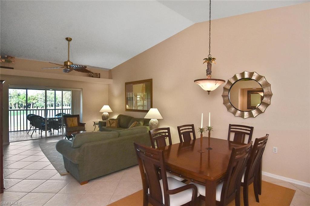 3870 Sawgrass Way, Unit 2521 Naples, FL 34112 - Photo 28 of 46 a living room with furniture a chandelier and a window