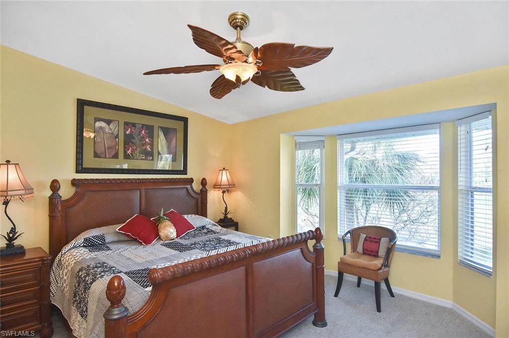3870 Sawgrass Way, Unit 2521 Naples, FL 34112 - Photo 31 of 46 a bedroom with a bed and a window