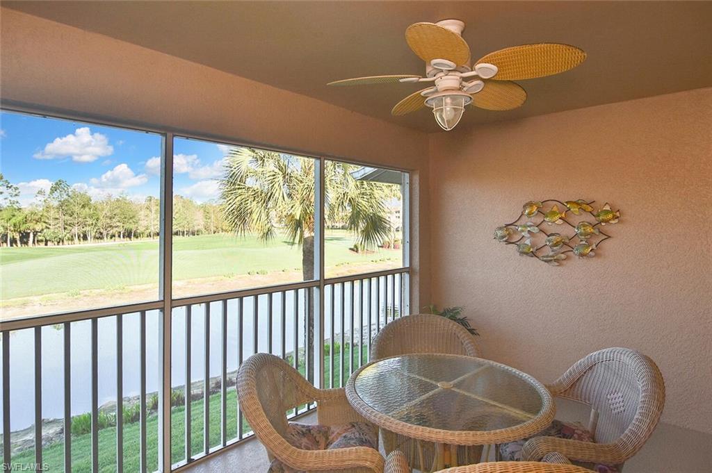 3870 Sawgrass Way, Unit 2521 Naples, FL 34112 - Photo 41 of 46 a table and a vase sitting on a table