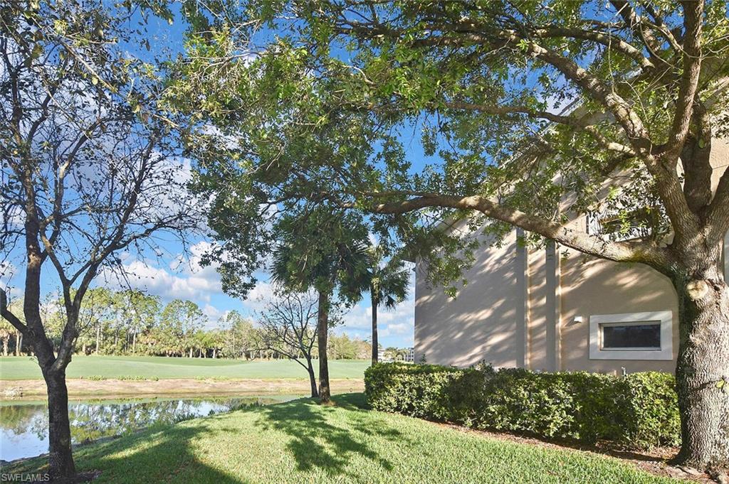3870 Sawgrass Way, Unit 2521 Naples, FL 34112 - Photo 45 of 46 a view of an outdoor space with a lake view