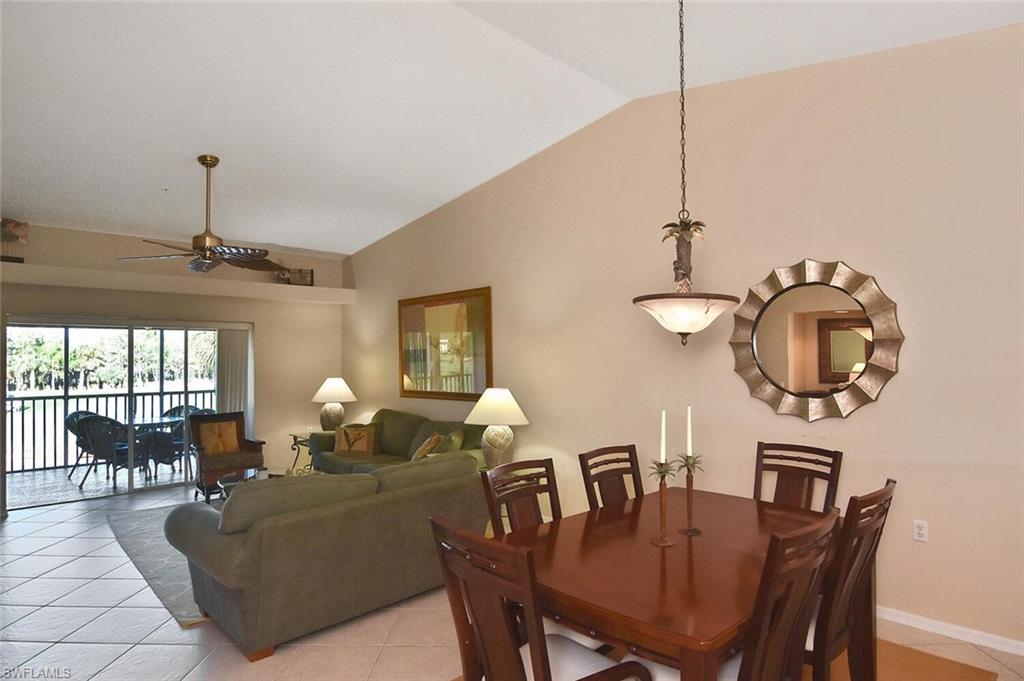 3870 Sawgrass Way, Unit 2521 Naples, FL 34112 - Photo 9 of 46 a view of a dining room with furniture