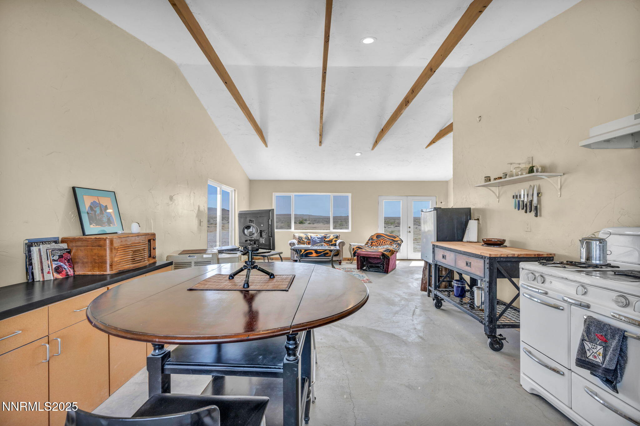 14995 Coal Canyon Road Lovelock, NV 89419 - Photo 11 of 37 a living room with stainless steel appliances furniture a table and chairs