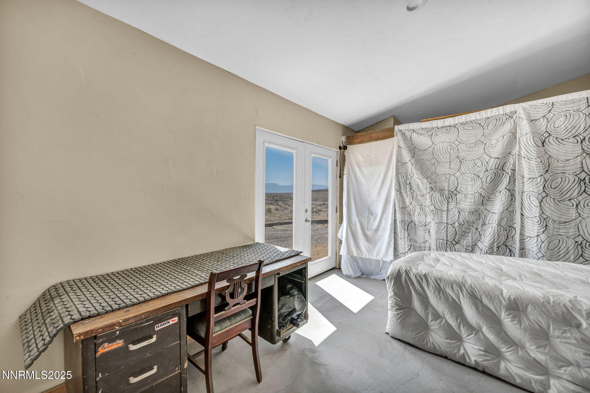 14995 Coal Canyon Road Lovelock, NV 89419 - Photo 15 of 37 a bedroom with a bed and a window